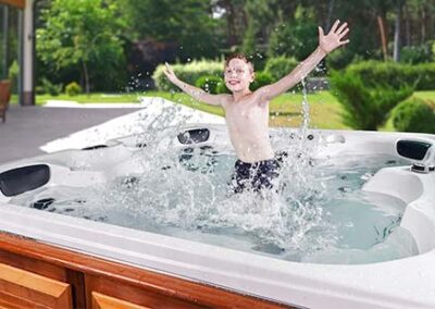 Jumping boy in an Arctic Spas hot tub